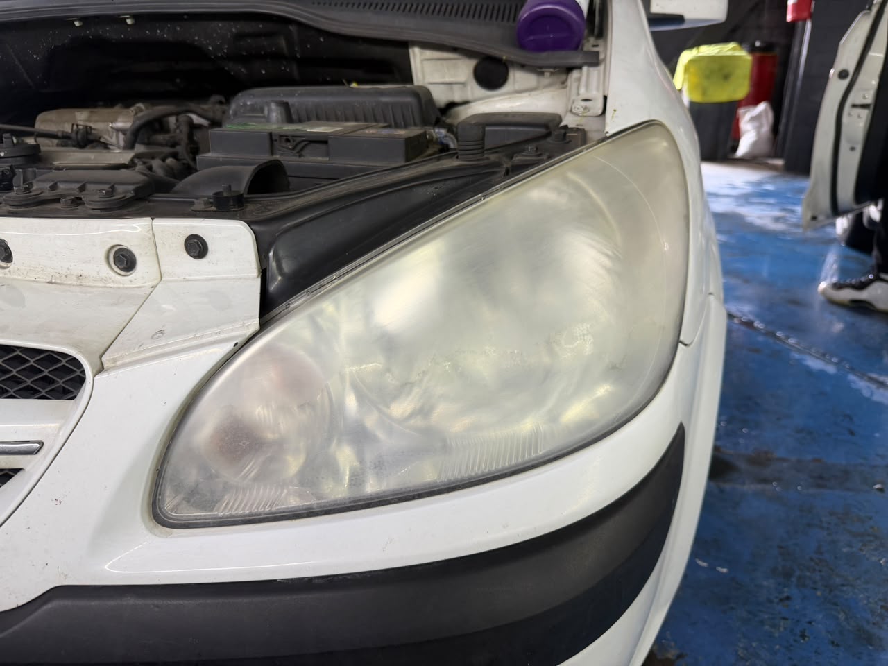 Cloudy headlight before restoration, right side